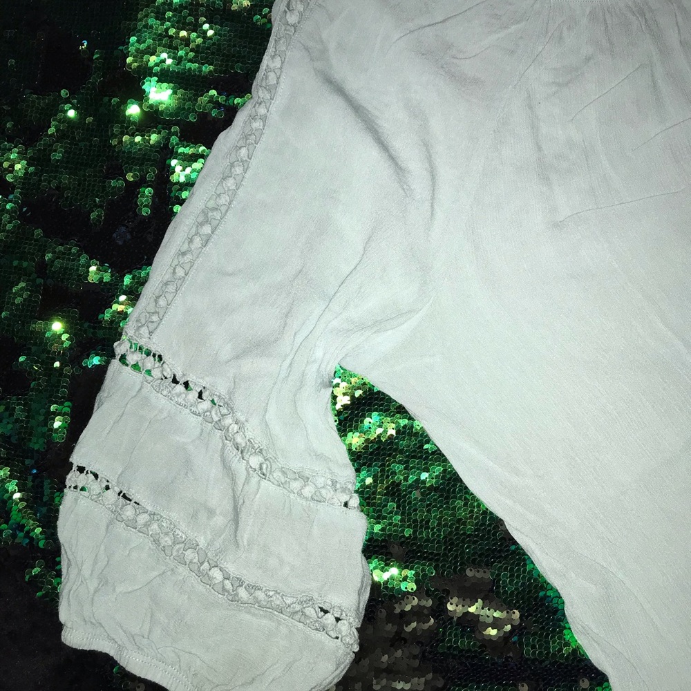 Light blue “FEVER” 2X top